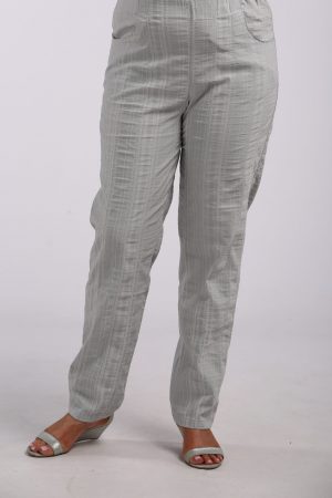 Woman wearing summer cool trousers in silver grey by K J Brand