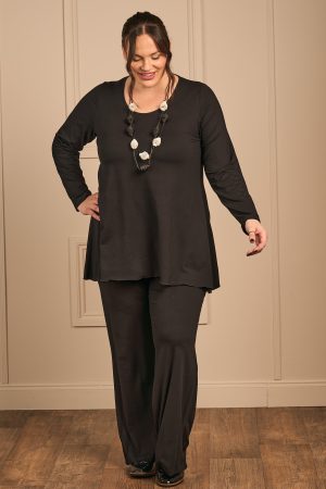 Our model is wearing Exelle Balo jersey palazzos in black for Froxx Clothing