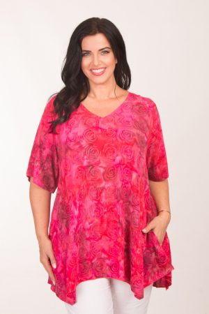 Our model is wearing Angel Circle V neck pocket top in pink for Froxx Clothing