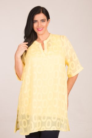 Our model is wearing See You sheer tunic in Citron for Froxx Clothing plus sizes